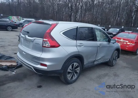 2016 Honda Cr-V Touring z USA, uszkodzony, nr VIN 5J6RM4H91GL125050